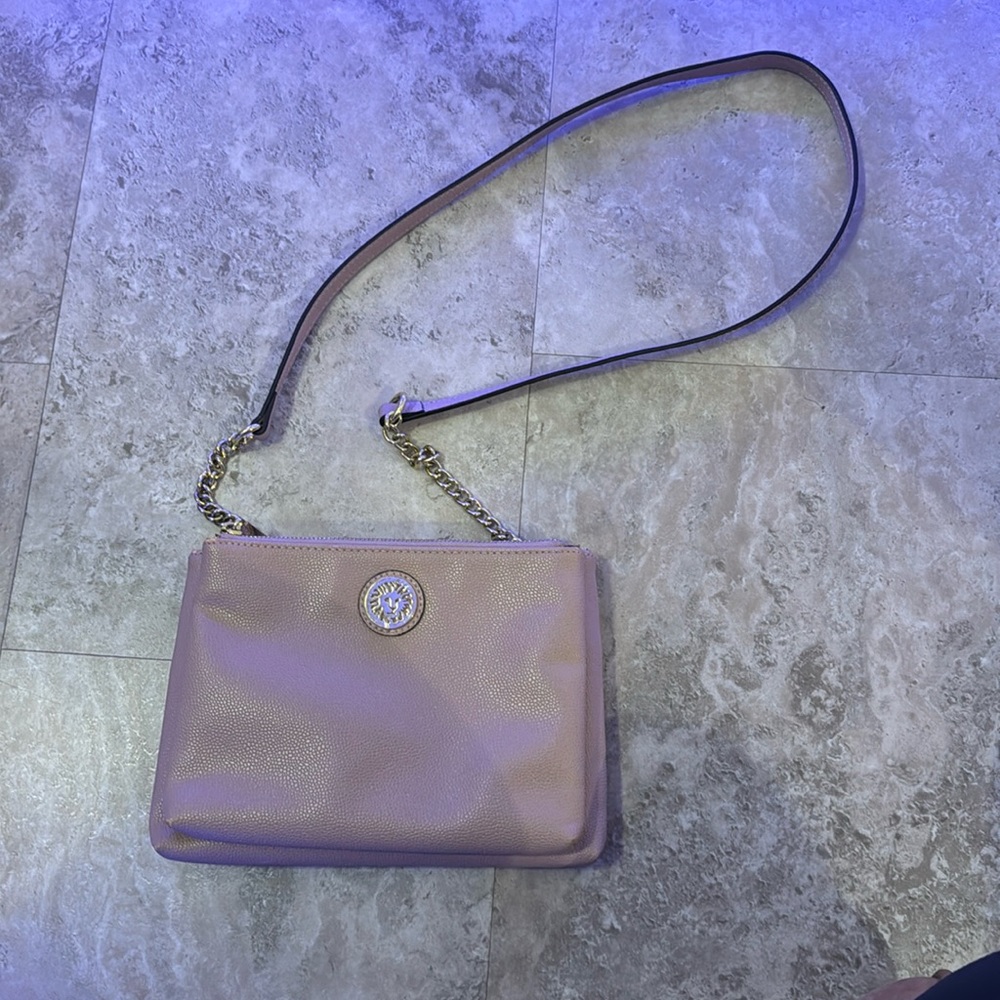 I’m selling a blush/ light pink purse, the brand is “anne klein”.